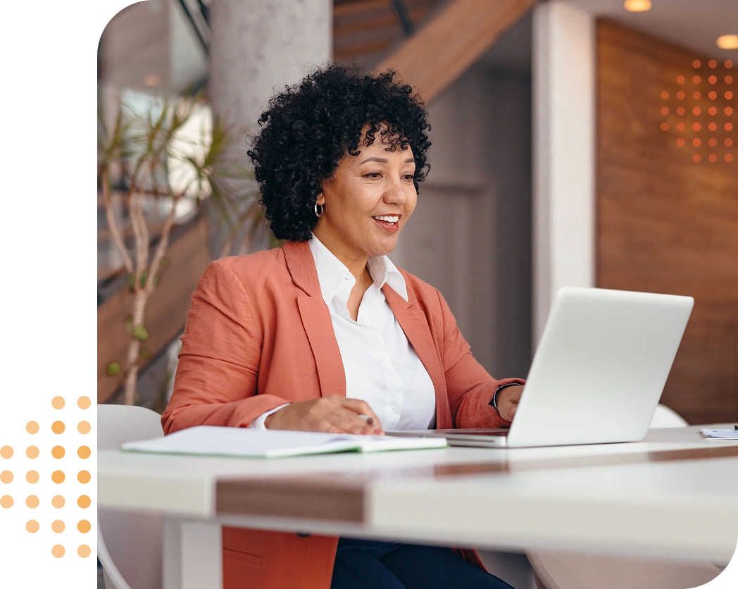 young businesswoman at a table on her laptop