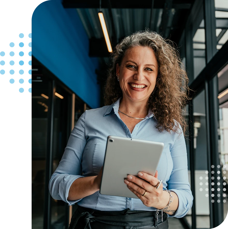 smiling woman holding a tablet - the soluta value, meet our team