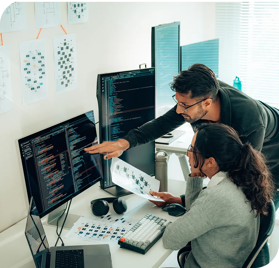 man & woman working together at a desk in the office